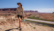 A woman walks above the Colorado River during a rafting trip with OARS in 2023
