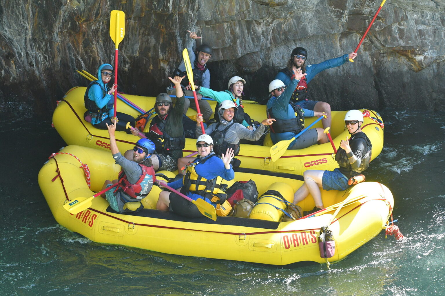 River guides in training stop to wave at the camera after running Tunnel Chute on the Middle Fork of the American River.