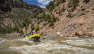 A raft full of people goes through a rapid on the Yampa River in Dinosaur National Monument in Utah