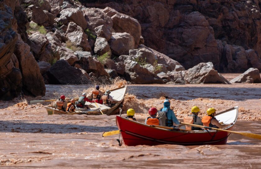 A pair of OARS dories going through a rapid on the Colorado River