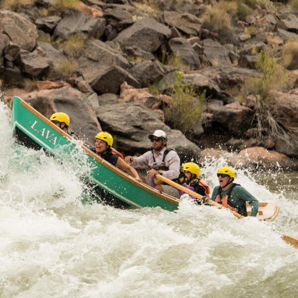 A dory charges through rapids in Grand Canyon