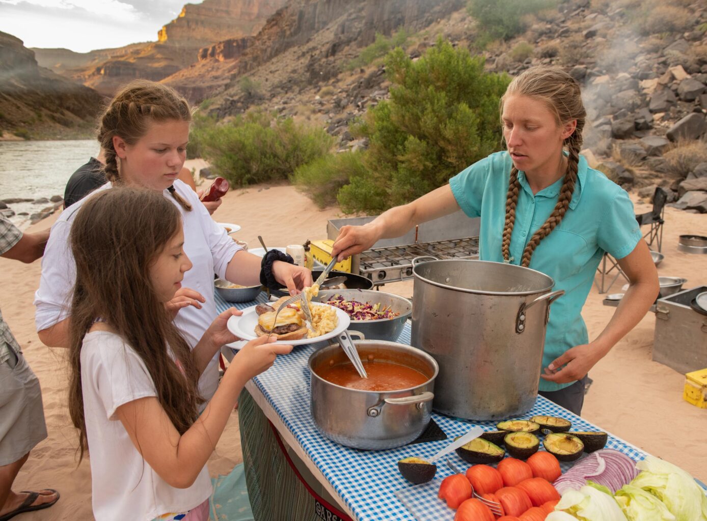 Serving food on an OARS Grand Canyon rafting trip