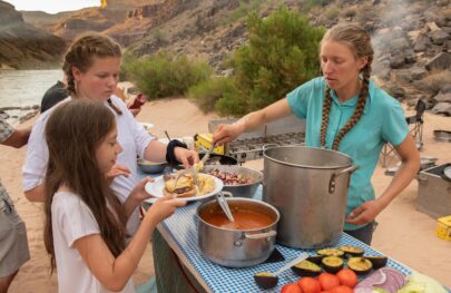 Serving food on an OARS Grand Canyon rafting trip