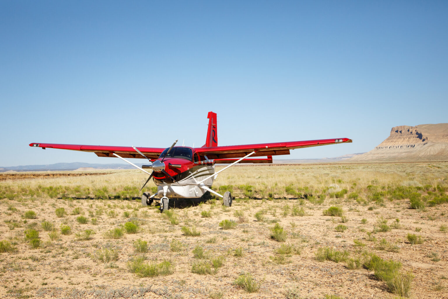 Air plane landed in the desert on an OARS Desolation Canyon trip