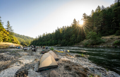 Tents on the Rogue River in Oregon during an OARS rafting trip in June, 2025.