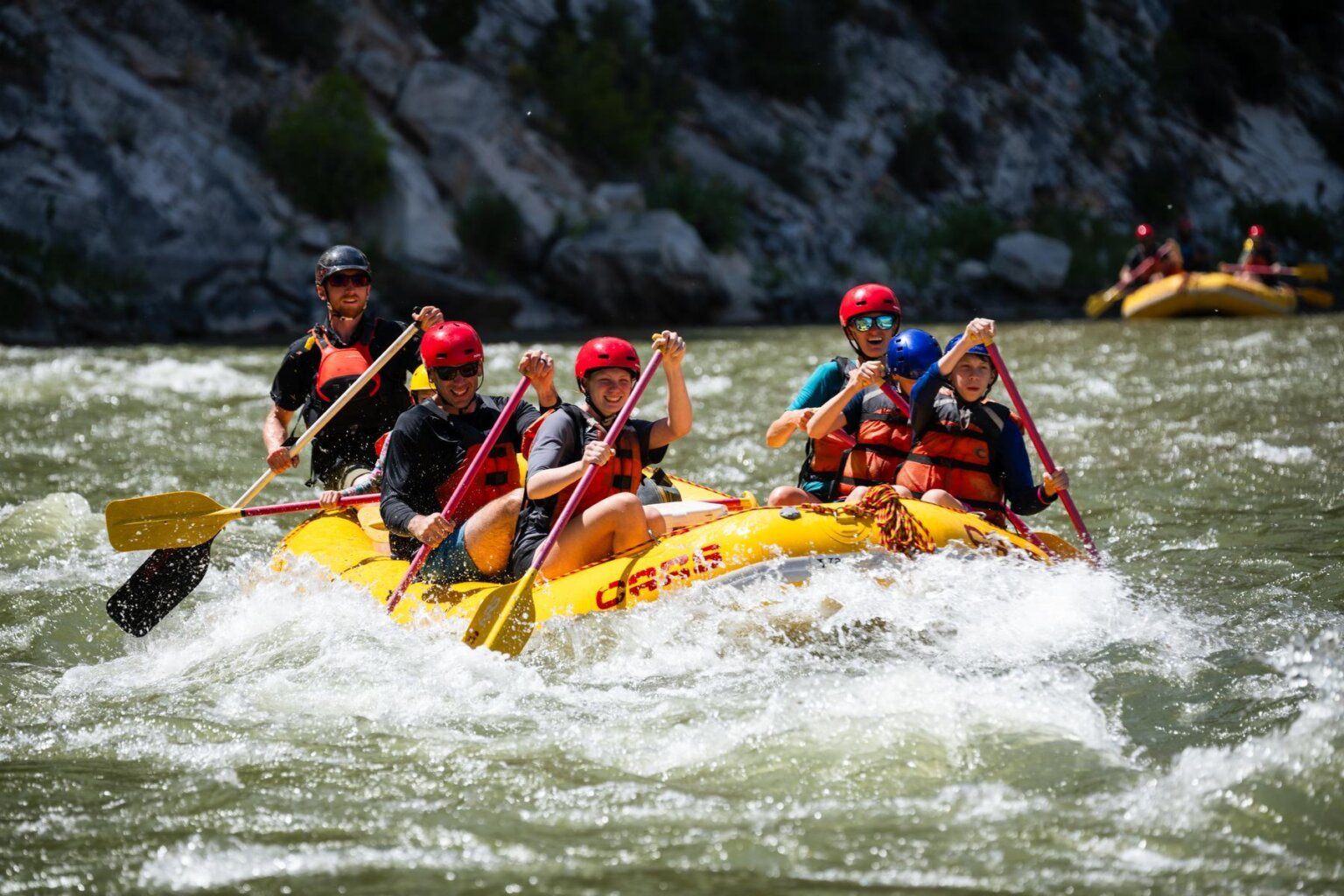 A family rafting on the Green River through Split Mountain Canyon with OARS in 2025.