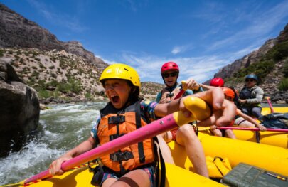 A little girl laughs while rafting the Split Mountain Canyon section of the Green River with OARS in 2025.