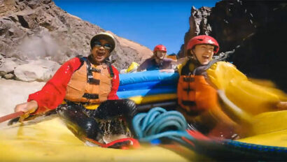 Two rafters in the middle of a whitwater rapid