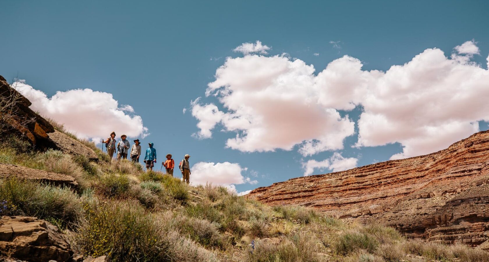Hikers acending a rim along the San Juan River in Utah