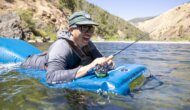 A fly fishermen floats in the Tuolumne River