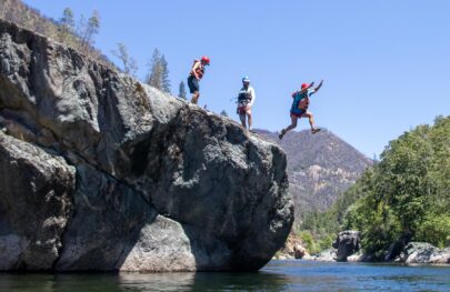 Jumping off a rock on the Middle Fork American River during an OARS two-day trip.