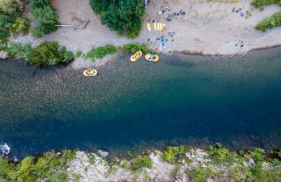 An aerial shot of camping on the Middle Fork American River during an OARS two-day trip