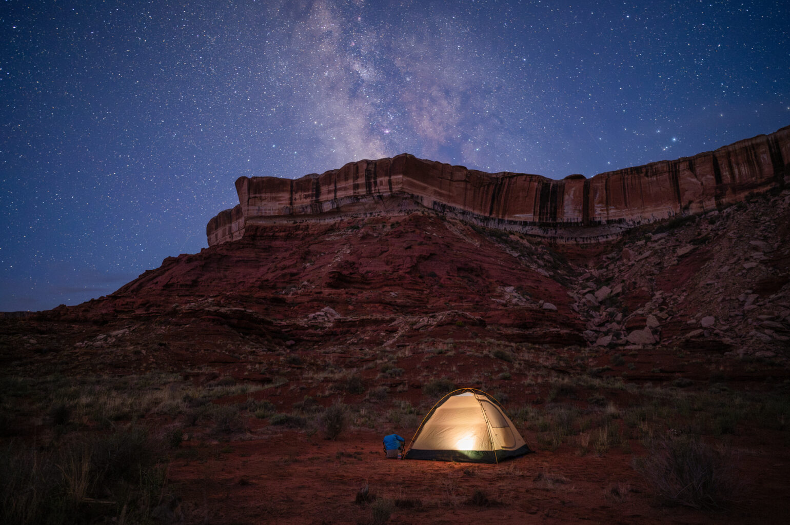 A tent under the stars during an OARS Stillwater hiking trip.