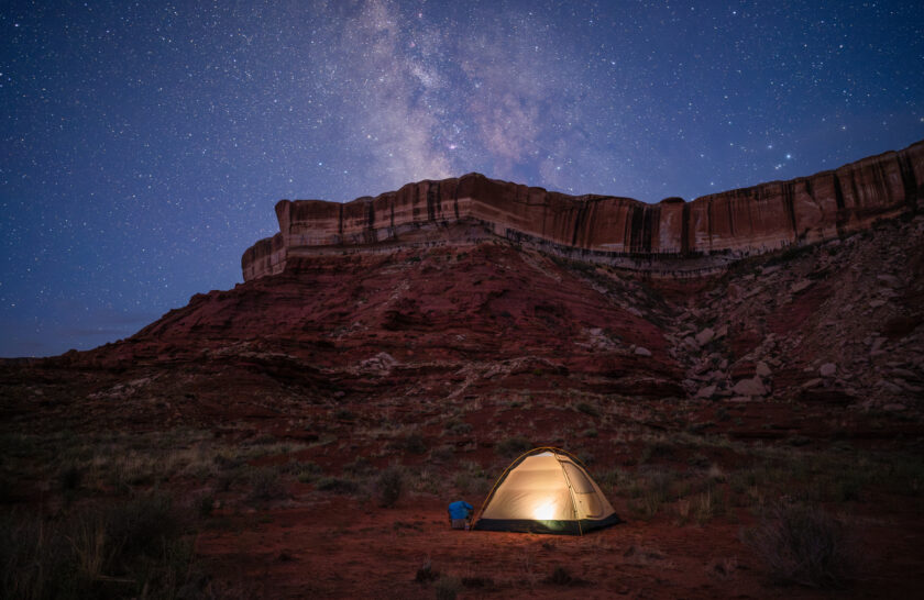 A tent under the stars during an OARS Stillwater hiking trip.
