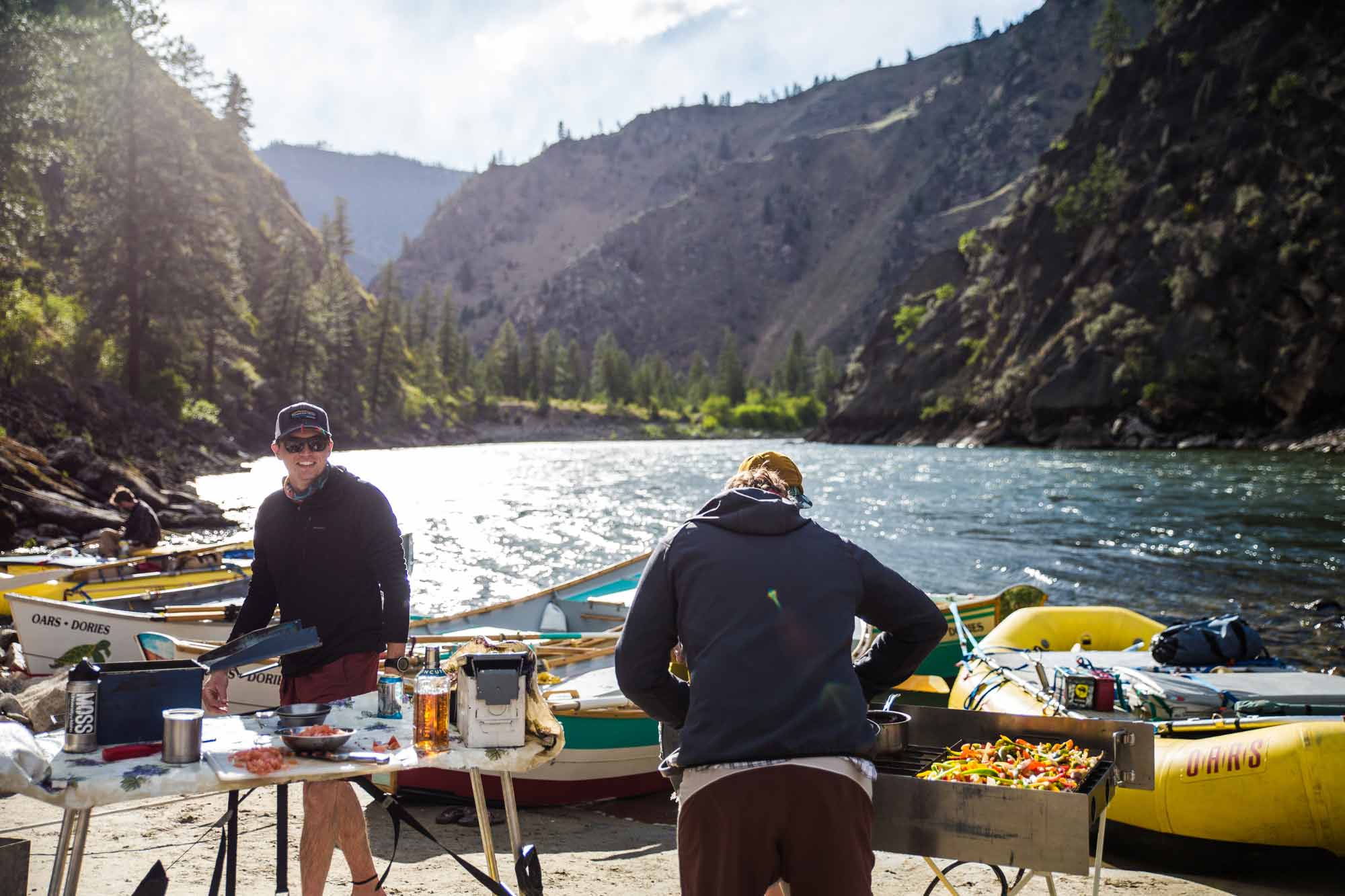 Guides preparing dinner on a multi-day river trip on the Salmon River in Idaho