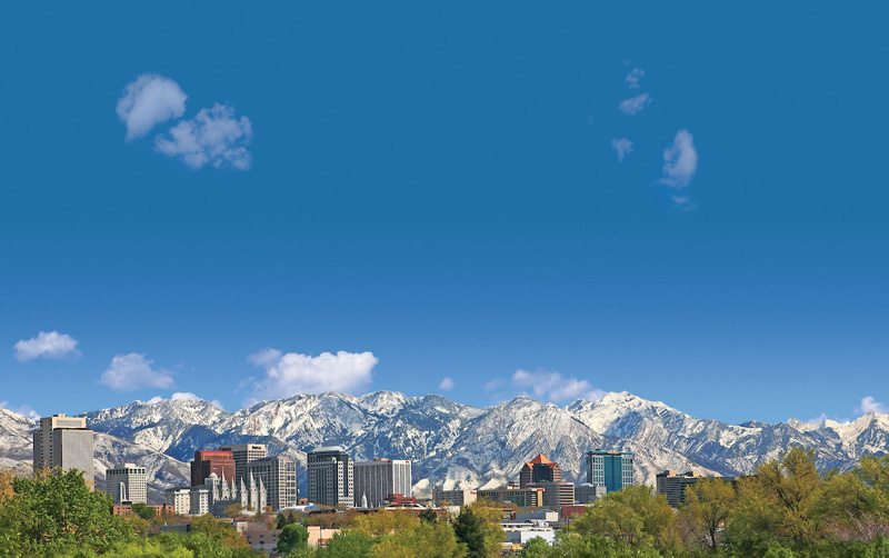 View of downtown Salt Lake City's skyline, a pit stop on a Wyoming road trip from San Francisco to Yellowstone & Grand Teton