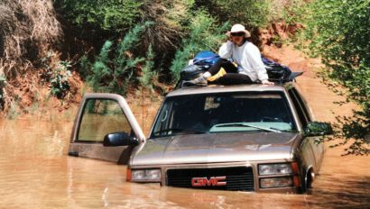 Sitting on top of a flooded SUV