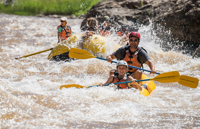 Family kayaking on river 