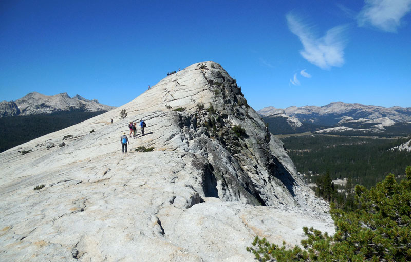 Group of hikers on top of Lembert Dome in Yosemite