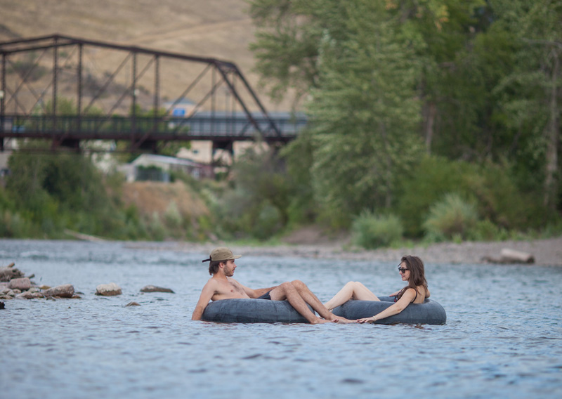 Clark Fork River tubing in Missoula, MT, one of the fun stops on a Wyoming road trip to Yellowston & Grand Teton