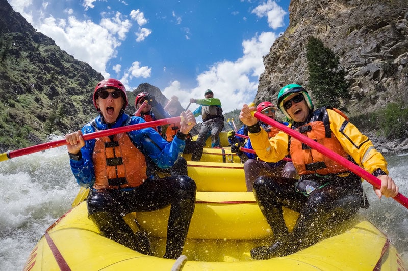 A group of people rafting.