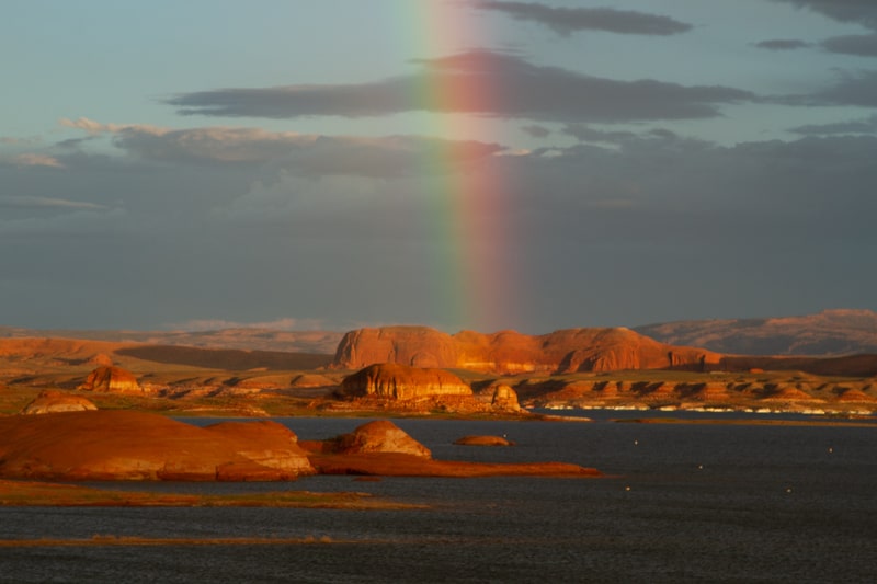A rainbow shows over Lake Powell