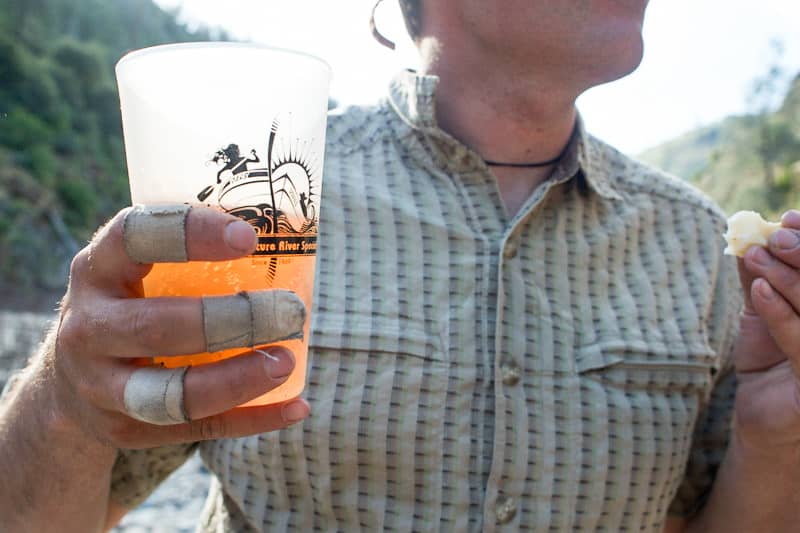 A rafter holding a beer in a frosty mug