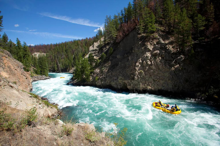 A rafting expedition charges into whitewater on the Chilko River