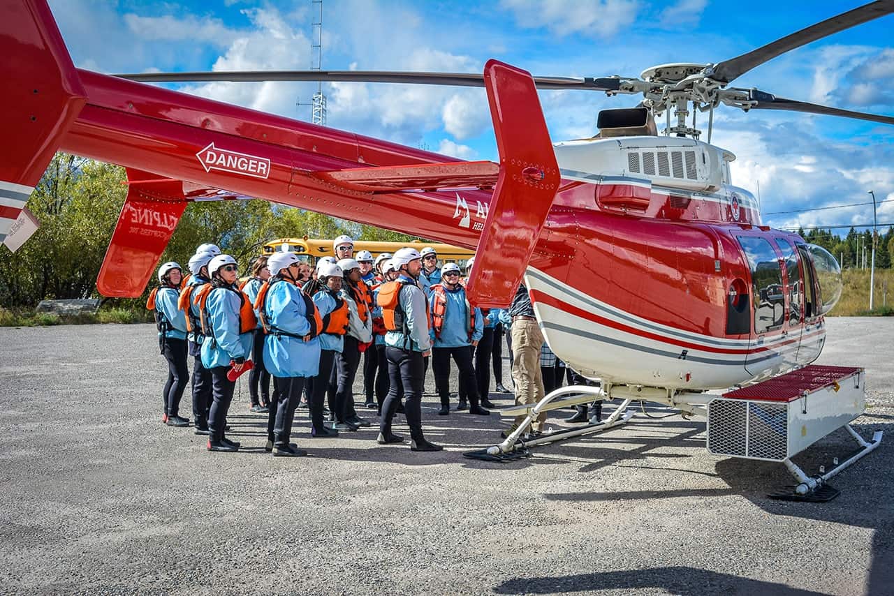 Rafters have a safety chat before boarding helicopter