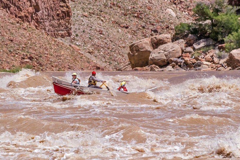 Dory running the Colorado River through Cataract Canyon