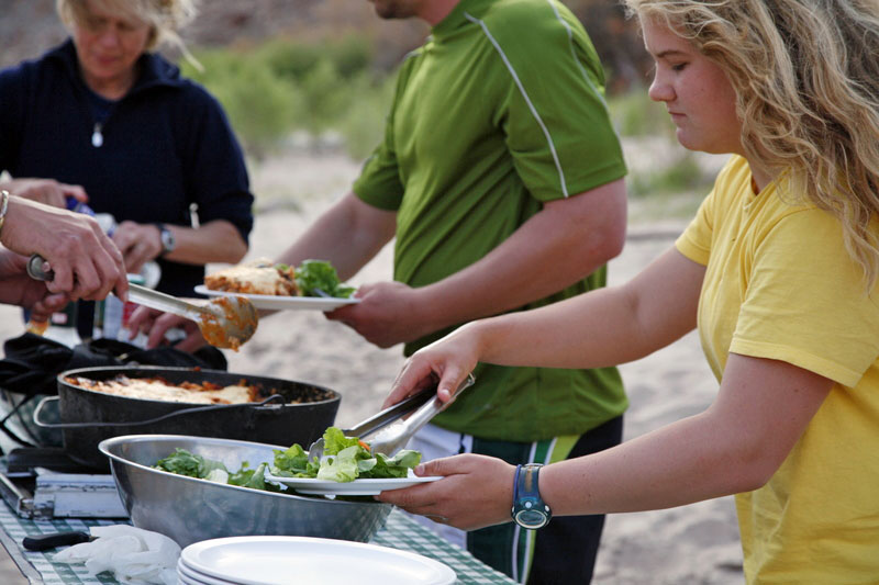 people in outdoor buffet line