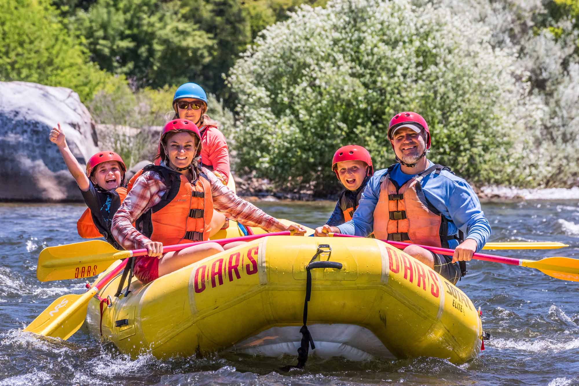 A family on a whitewater rafting trip on California's American River