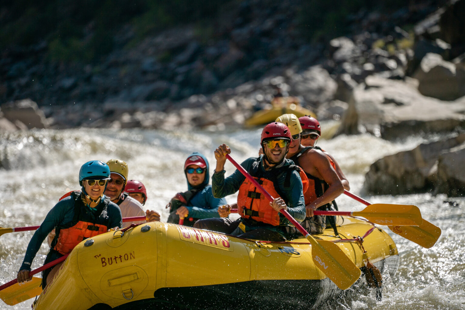 Happy rafters in mild whitewater on an OARS trip through Westwater Canyon, UT