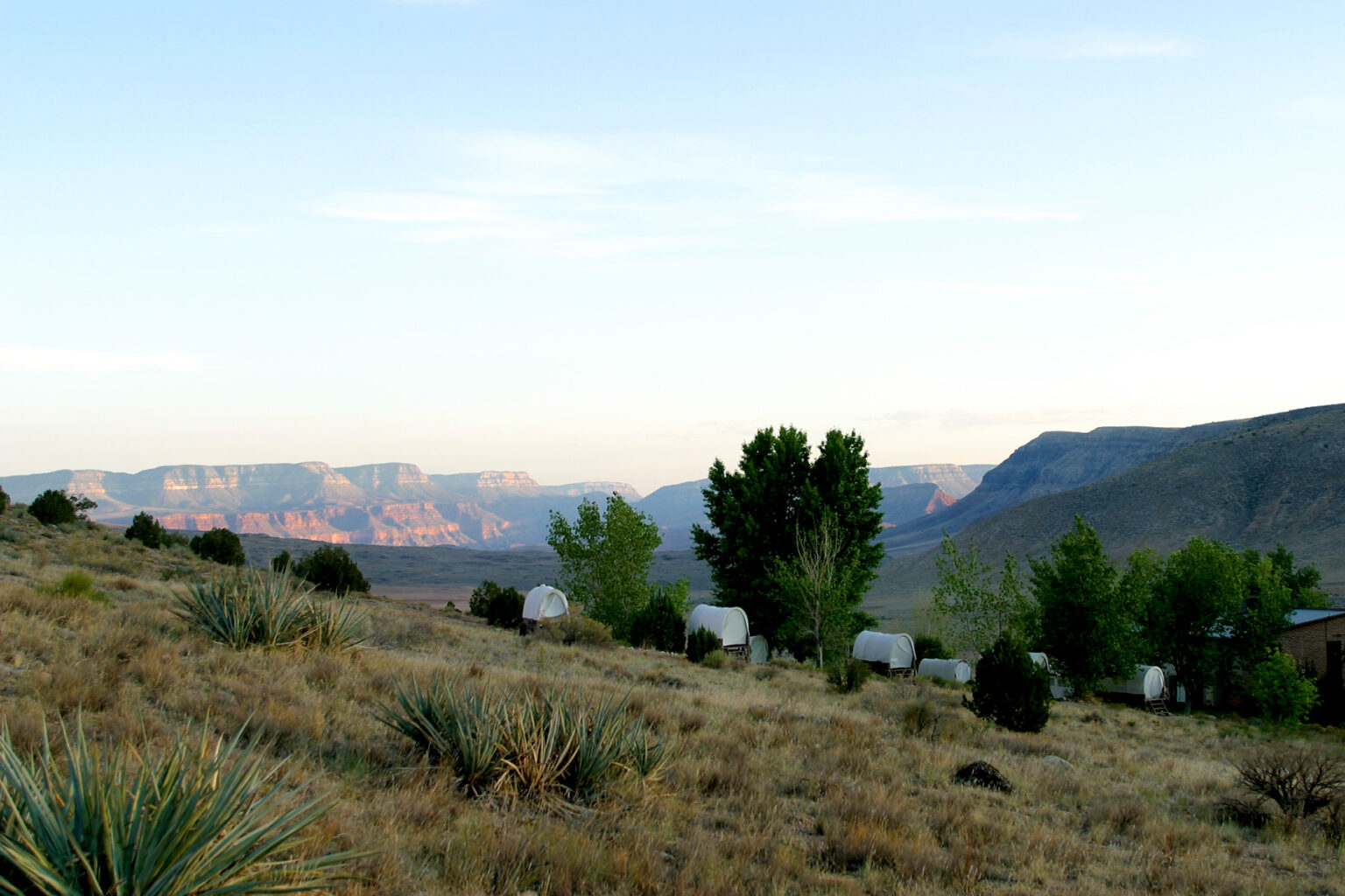 Chuckwagon tents at Bar 10 Ranch with Grand Canyon in background