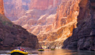 Three OARS rafts row through breathtaking canyon