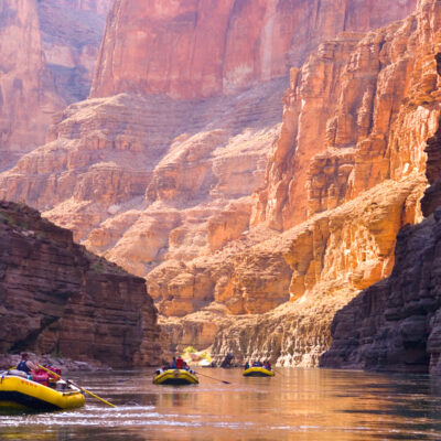 Three OARS rafts row through breathtaking canyon