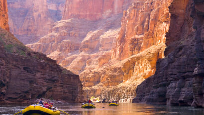 Three OARS rafts row through breathtaking canyon