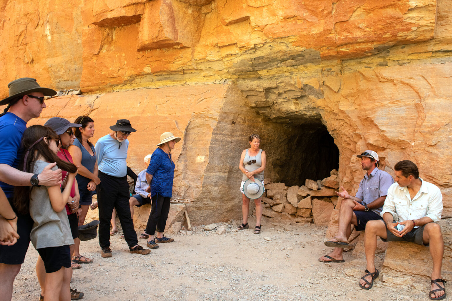 OARS guide provides interpretive talk to guests at an ancient granary near the Colorado River in Grand Canyon