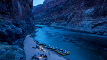 OARS rafts and dories stop to camp for the night deep in Grand Canyon