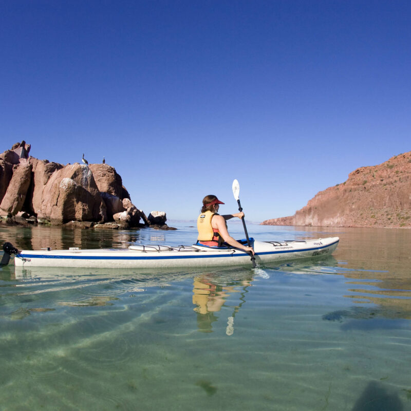 Woman sea kayaking in Baja, Mexico.