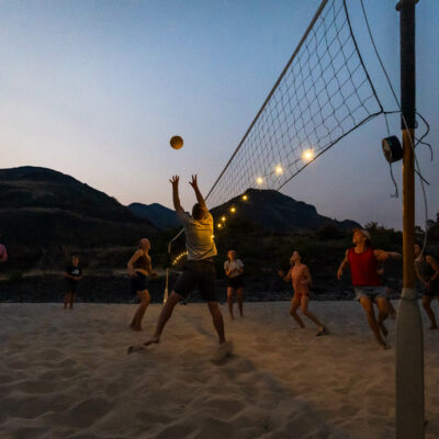 People playing volleyball on the Lower Salmon river bank.