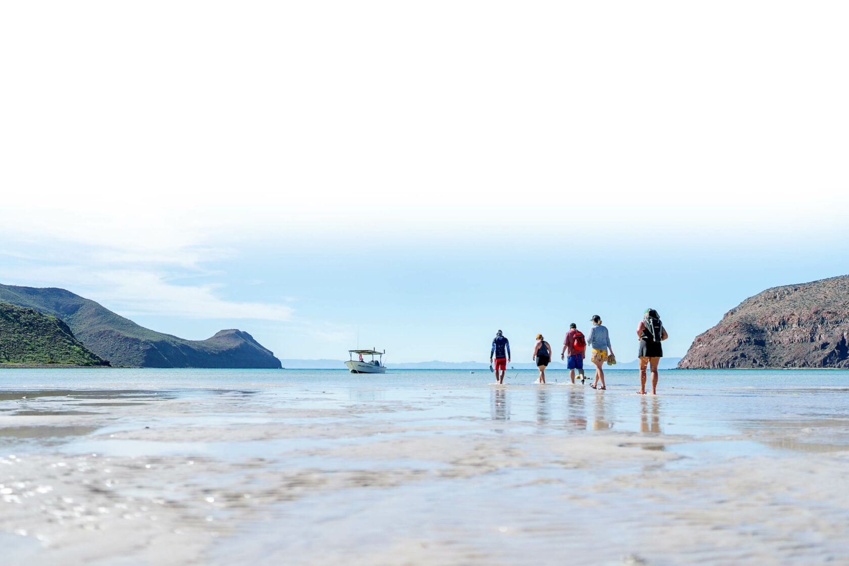 Group walking on the beach in Baja, Mexico.