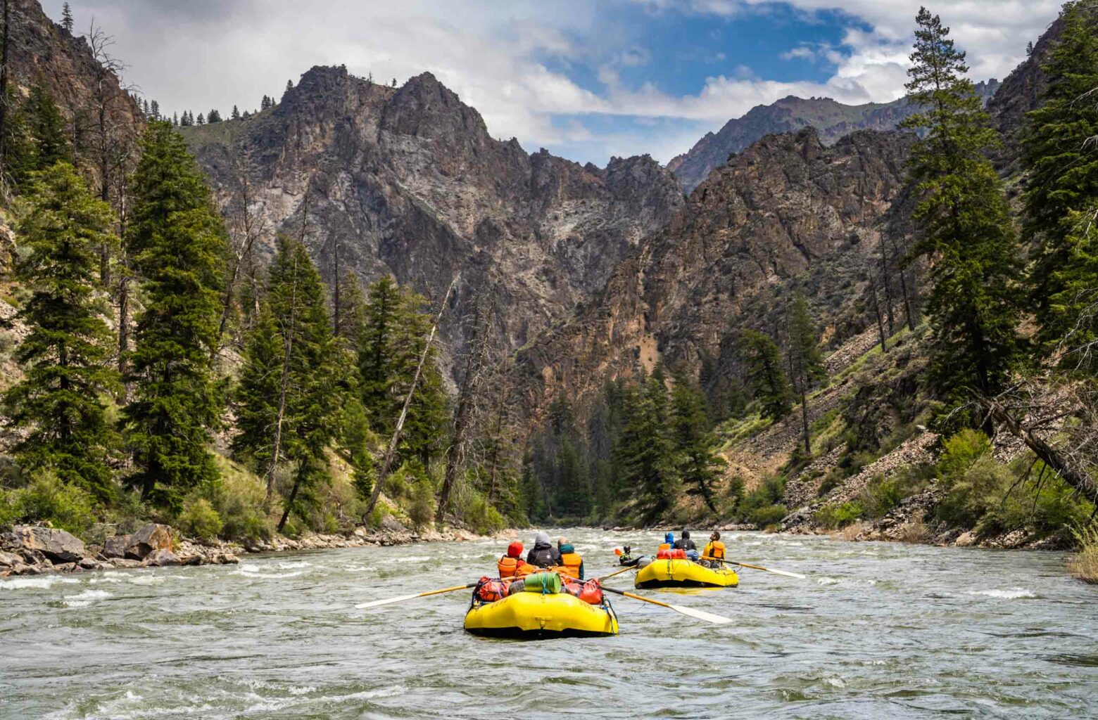 Two groups of people white water rafting in the Middle Fork of the Salmon River.