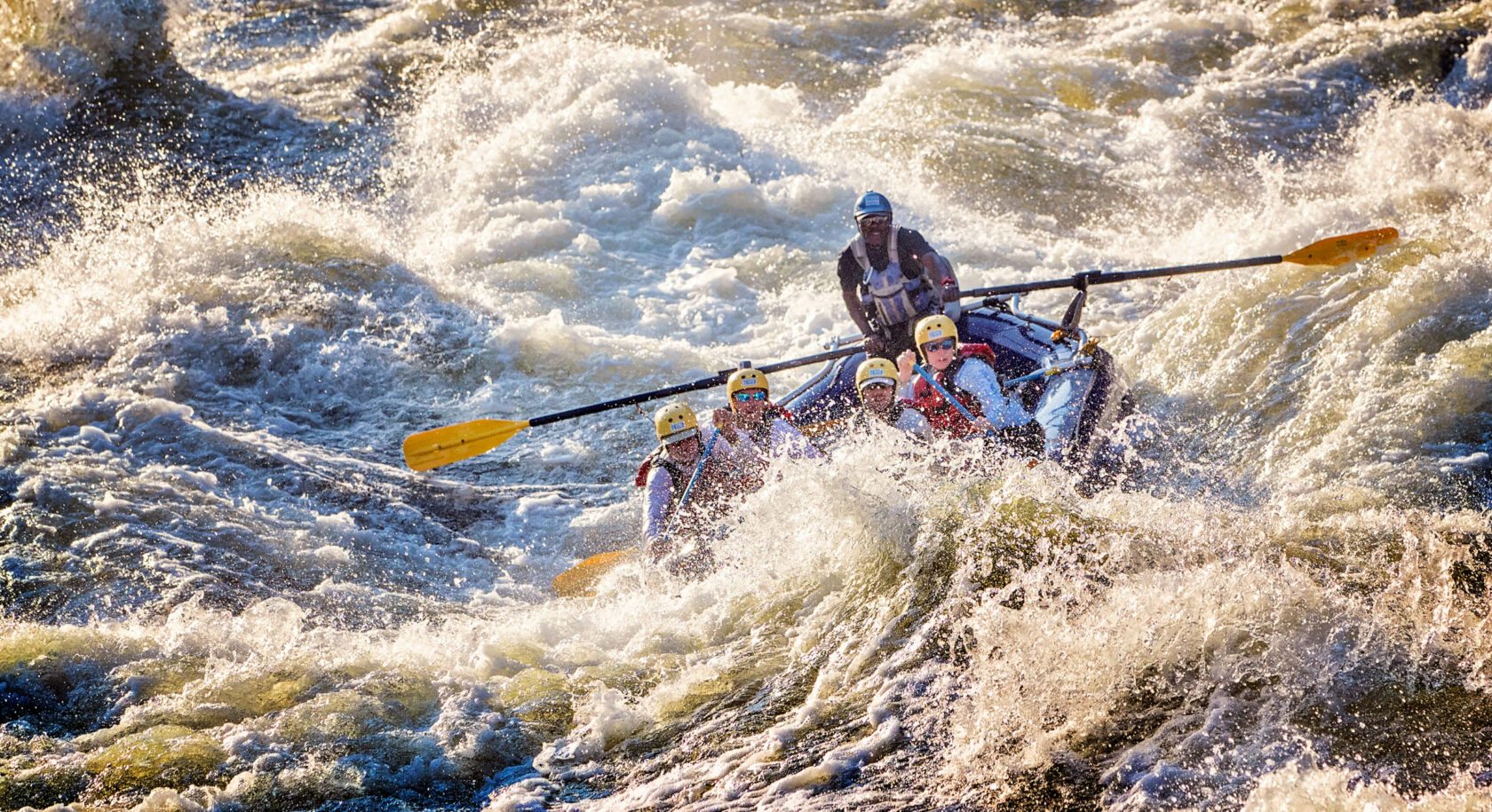 Rafters conquering some of the biggest commercially run whitewater in the world on the Zambezi River in Zambia.