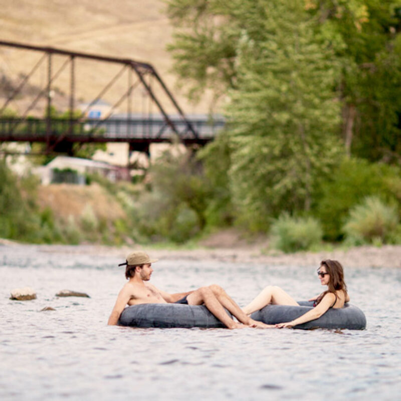 People floating down a river in tubes in Wyoming.