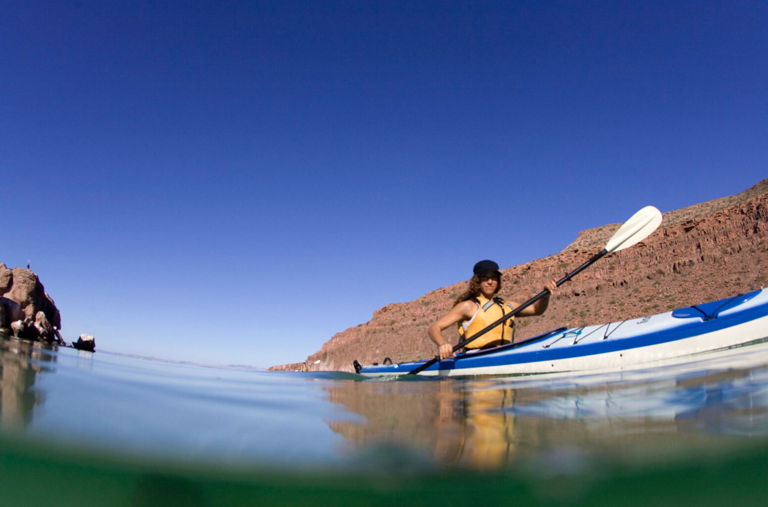A woman flatwater kayaking.