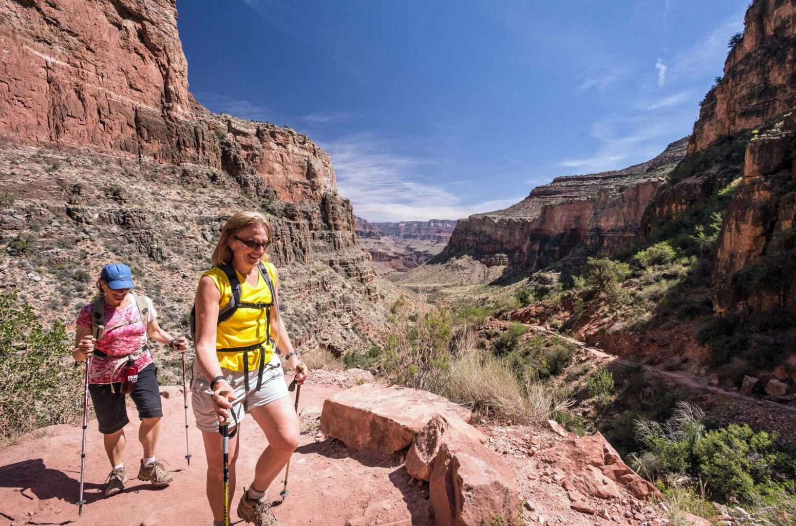 Two women hiking up the Bright Angel Trail in Grand Canyon National Park.