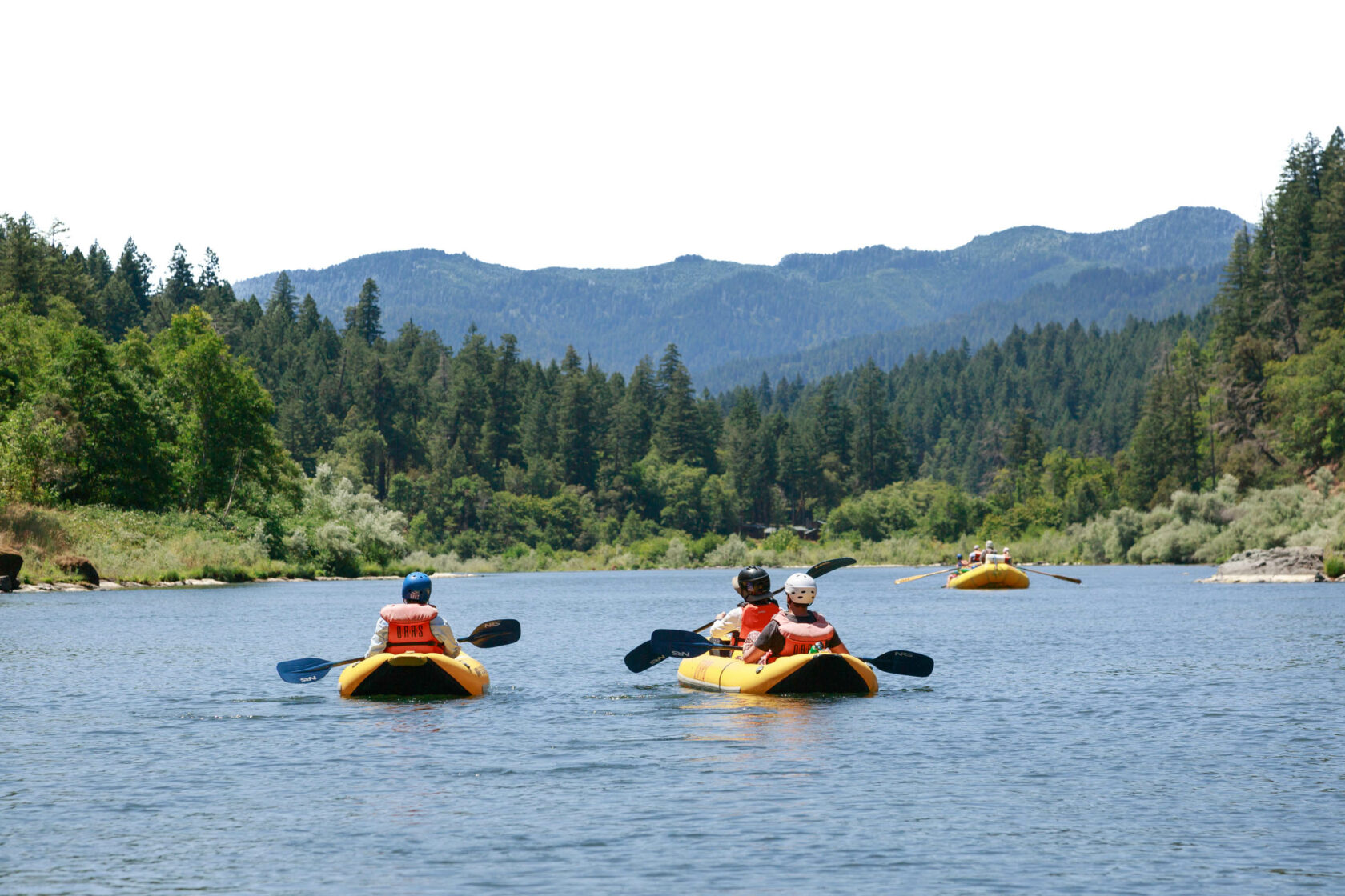 People kayaking on the rogue river.