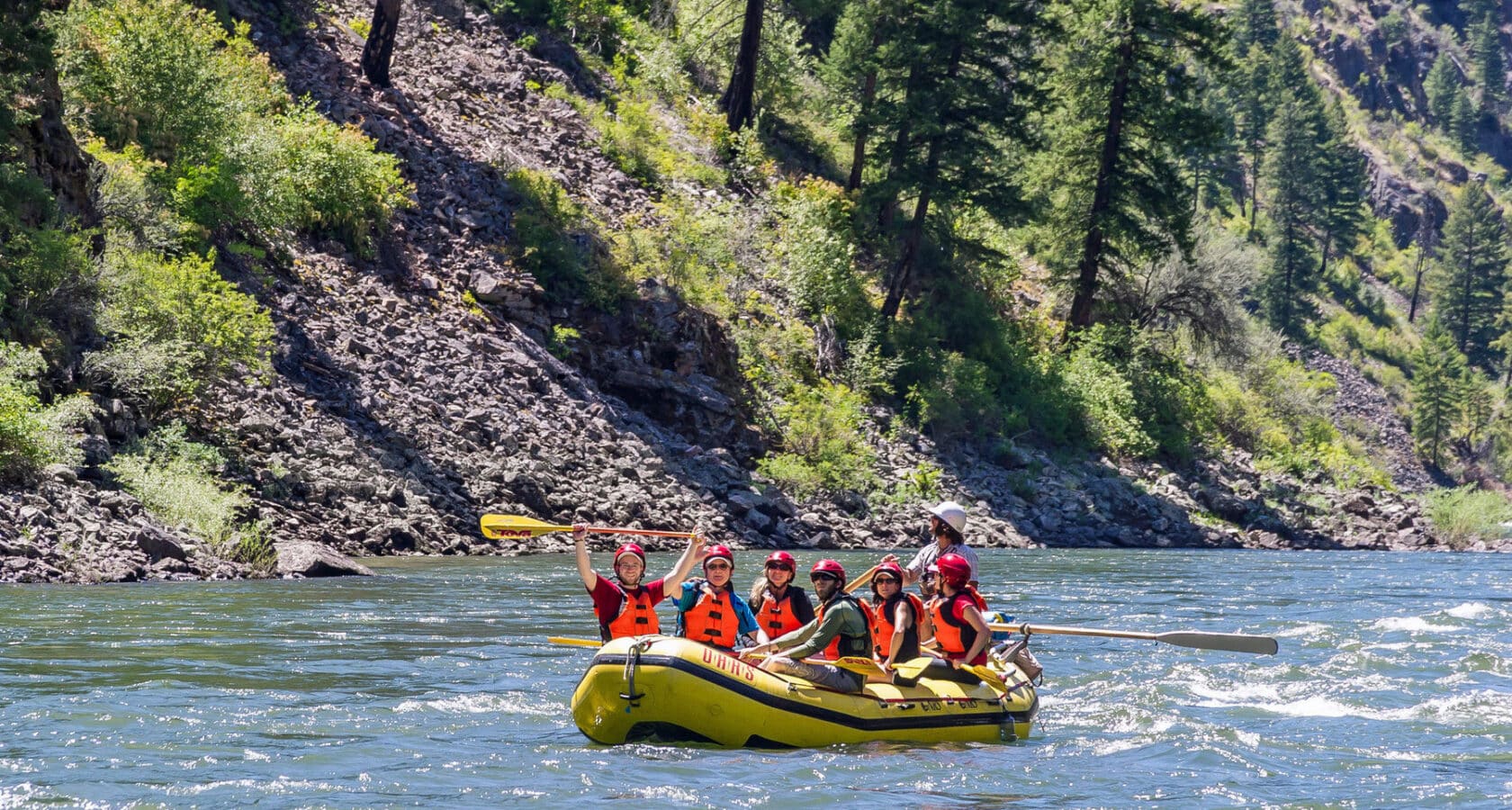 A group of people on a paddle raft on the Main Salmon River in Idaho.