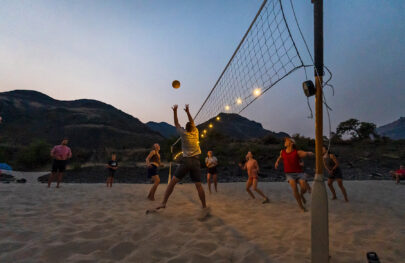 Luci solar lights illuminate an evening volleyball game on the Lower Salmon River